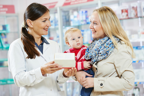 Pharmacy chemist, mother and child in drugstore